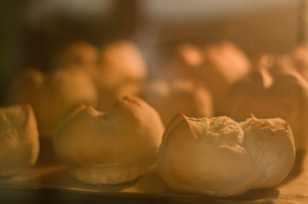Homemade Czech buchty pastries cooling on a wooden board