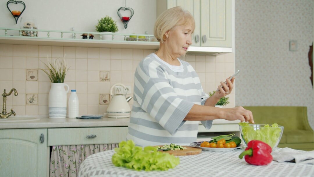 woman chopping vegetables in kitchen