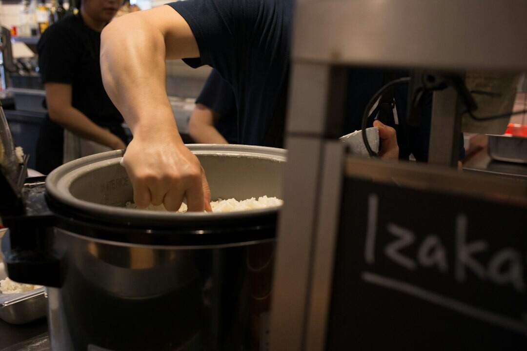 person using slow cooker